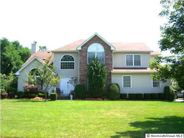 45 Georgetown Road Eatontown, NJ 07724 - Photo 1 of 3 a front view of a house with a yard and garage