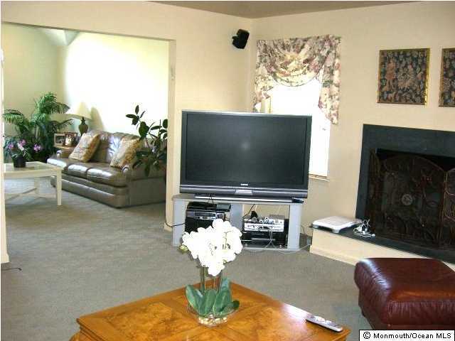 45 Georgetown Road Eatontown, NJ 07724 - Photo 3 of 3 a living room with furniture and a flat screen tv
