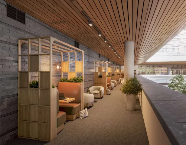 a lobby with furniture and floor to ceiling window