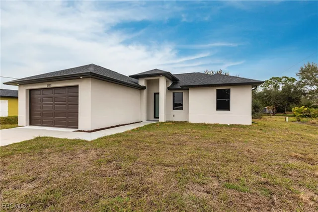 a house view with a backyard space