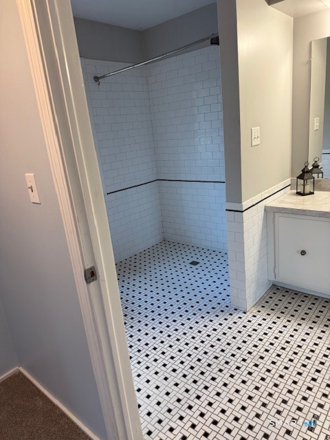 85 River Road, Unit M4 Essex, CT 06426 - Photo 9 of 9 a bathroom with a sink a toilet a mirror and shower