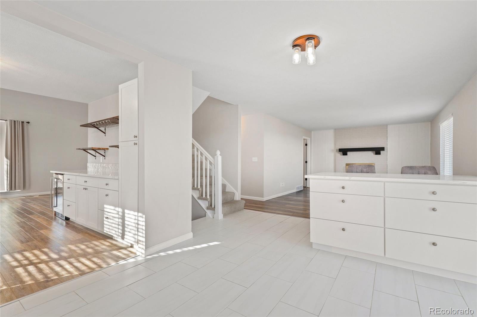 5484 South Cimarron Road Littleton, CO 80123 - Photo 14 of 40 a spacious bedroom with a bed and a cabinets