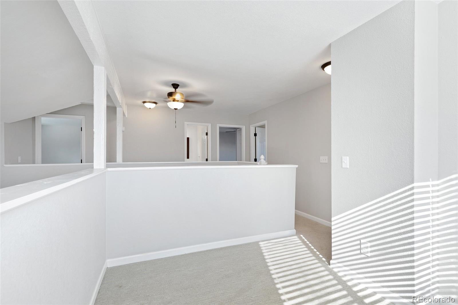 5484 South Cimarron Road Littleton, CO 80123 - Photo 30 of 40 a view of a living room with a large window