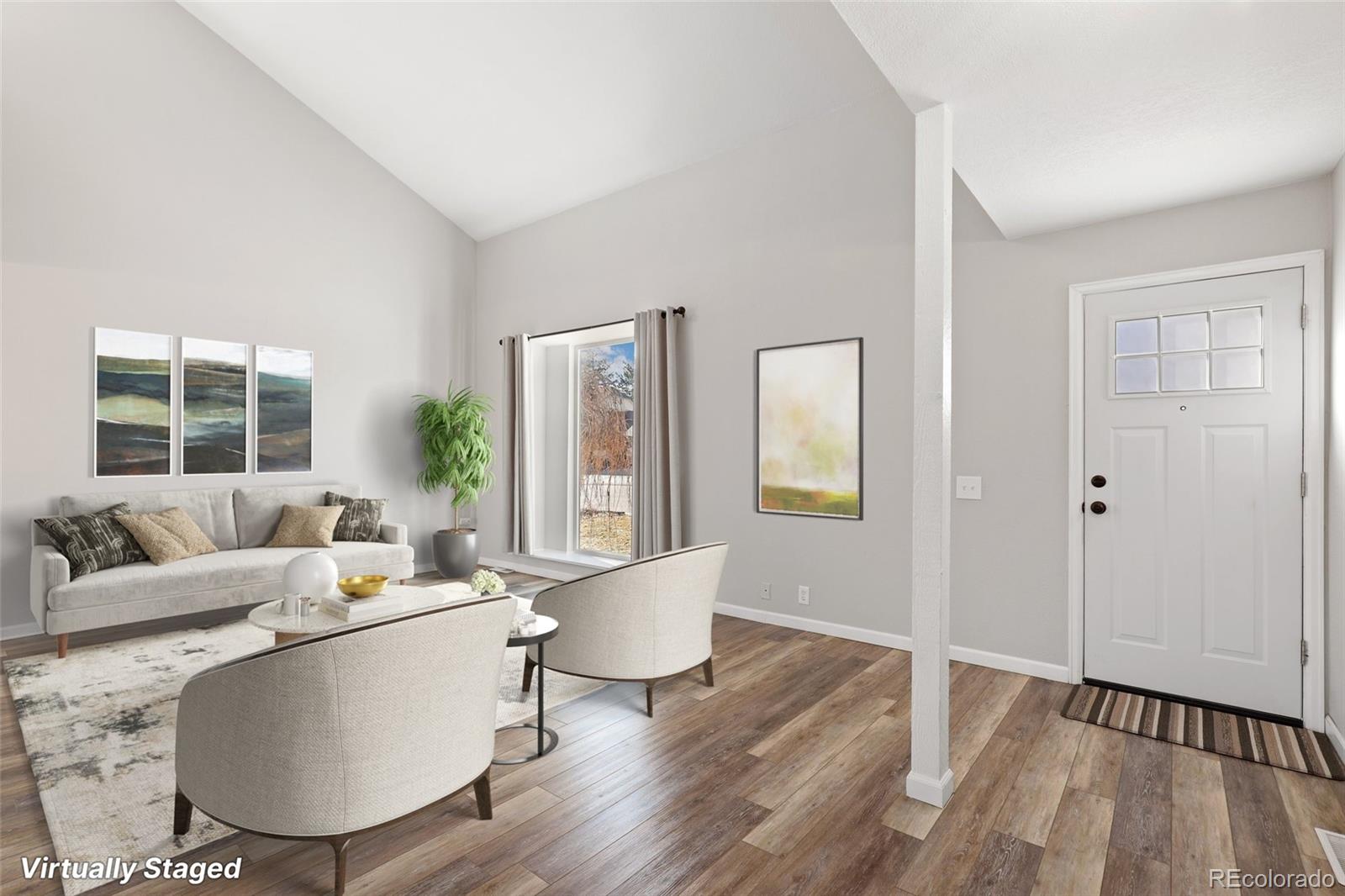 5484 South Cimarron Road Littleton, CO 80123 - Photo 3 of 40 a living room with furniture and a large window
