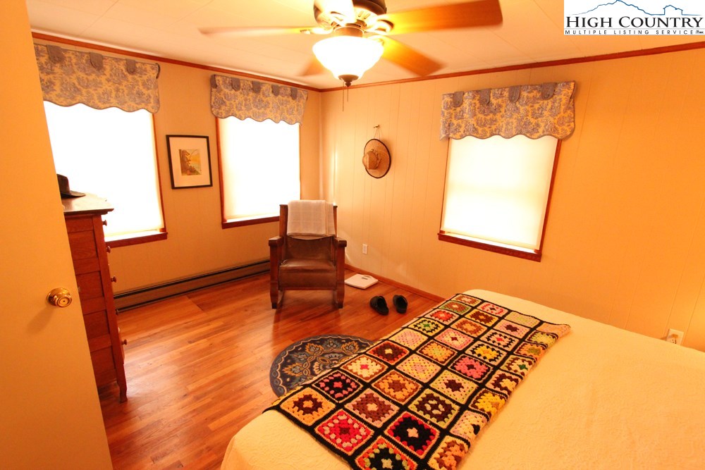 3772 Spring Valley Road Elk Creek, VA 24326 - Photo 12 of 30 a bedroom with a bed and a table in it