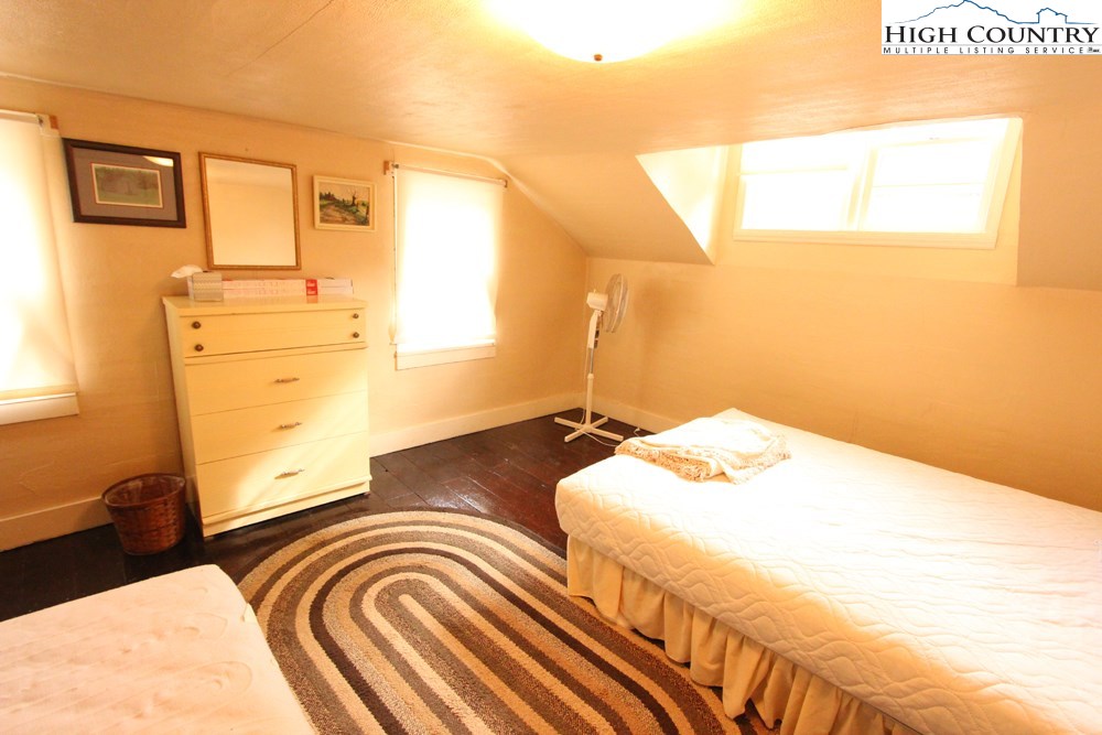 3772 Spring Valley Road Elk Creek, VA 24326 - Photo 14 of 30 a bedroom with a bed and wooden floor
