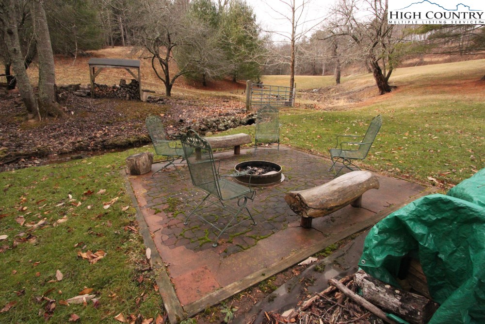 3772 Spring Valley Road Elk Creek, VA 24326 - Photo 18 of 30 a view of a backyard with sitting area