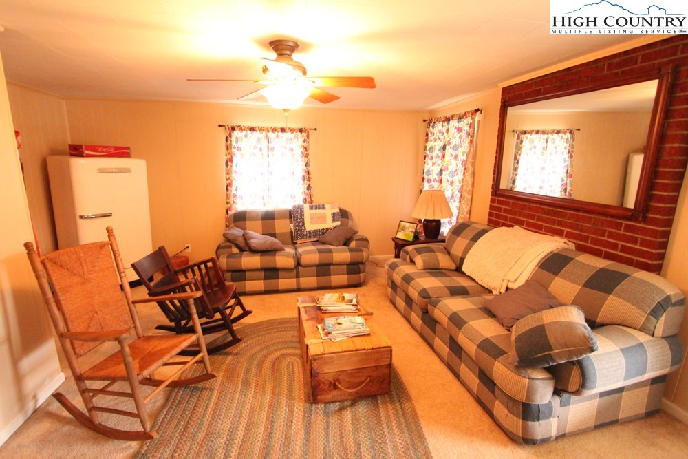 3772 Spring Valley Road Elk Creek, VA 24326 - Photo 8 of 30 a living room with furniture and a large window