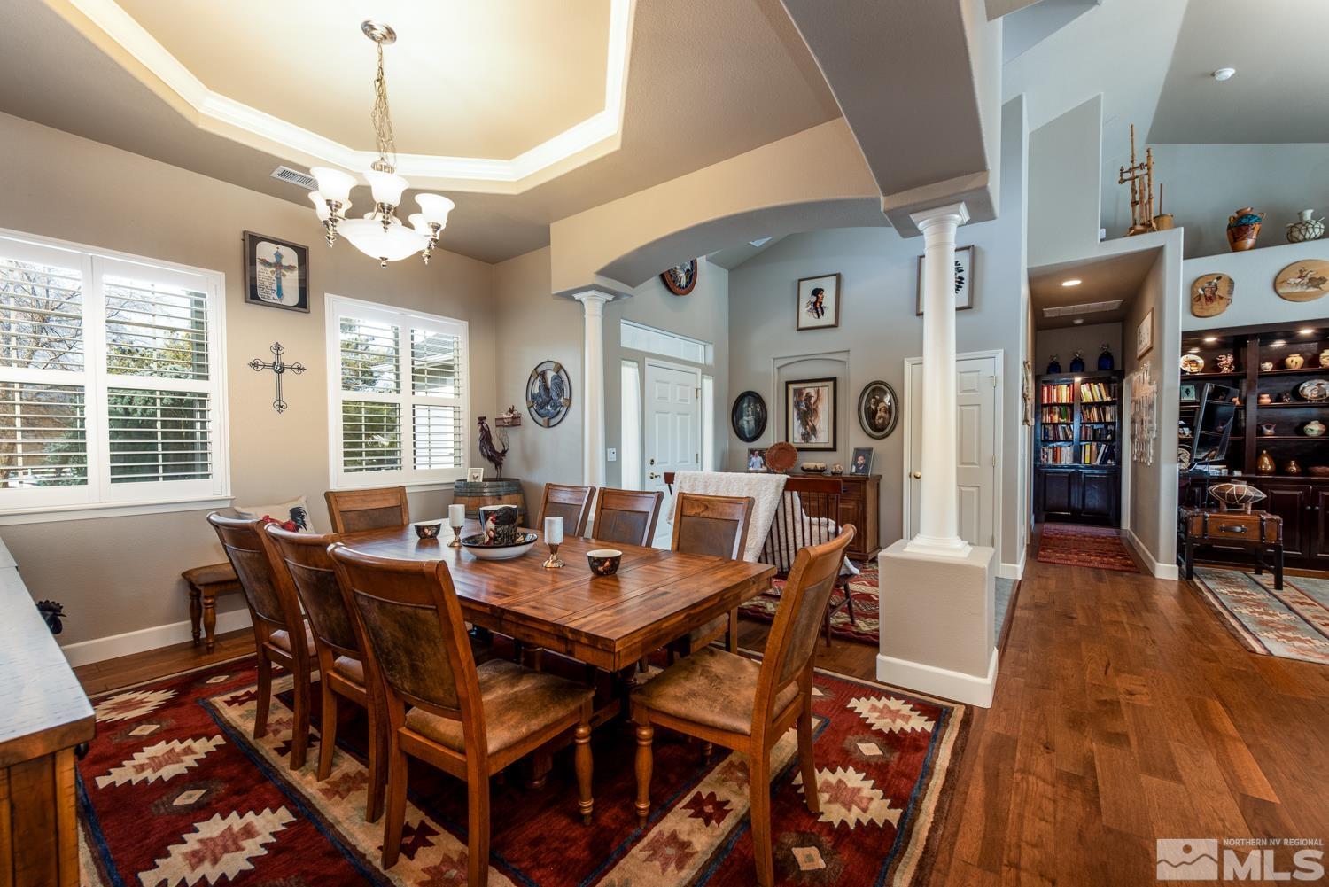 2603 Skyline Drive Minden, NV 89423 - Photo 12 of 40 a view of a dining room with furniture a chandelier and wooden floor