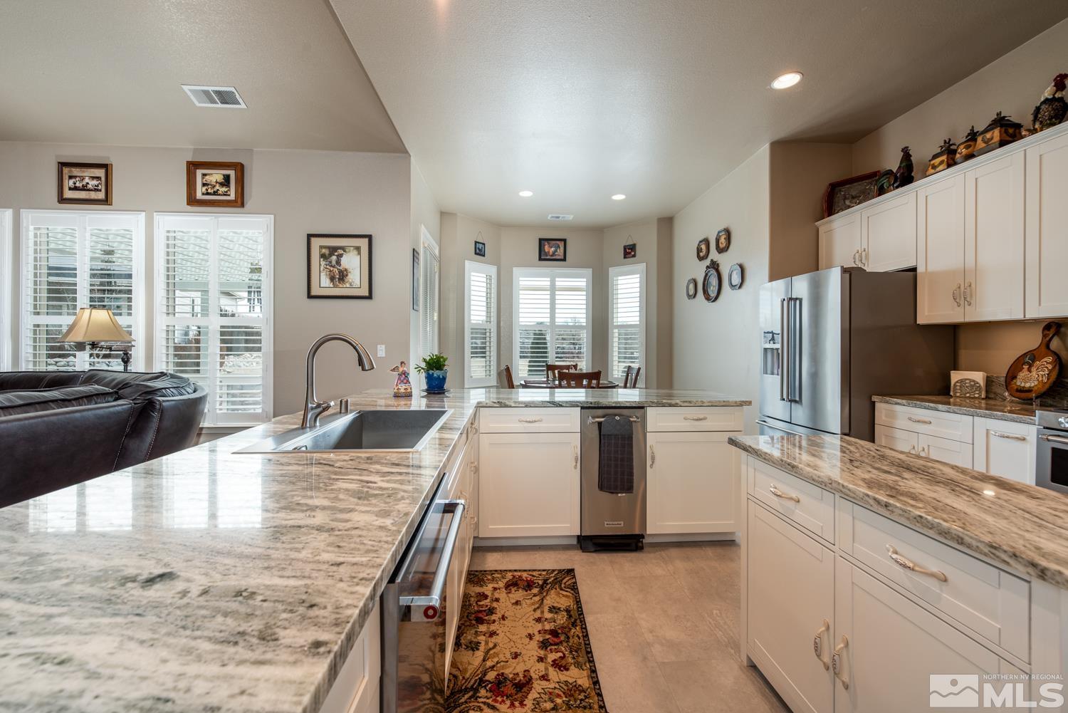 2603 Skyline Drive Minden, NV 89423 - Photo 14 of 40 a large kitchen with granite countertop a large counter top appliances and cabinets