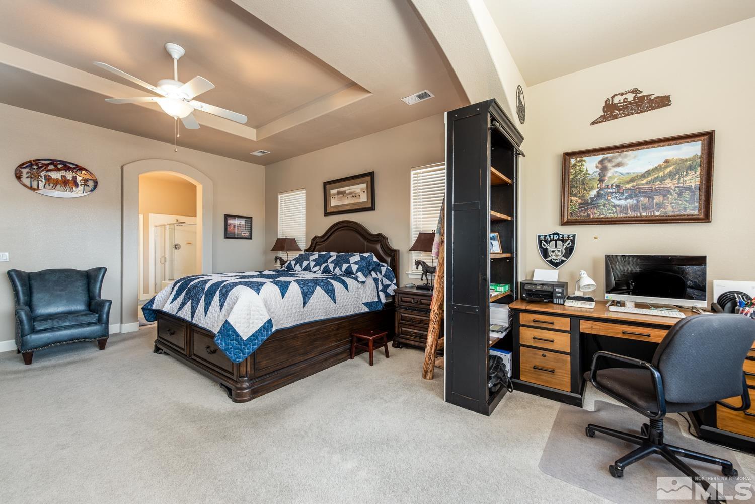 2603 Skyline Drive Minden, NV 89423 - Photo 19 of 40 a bedroom with a bed chair and wall paintings