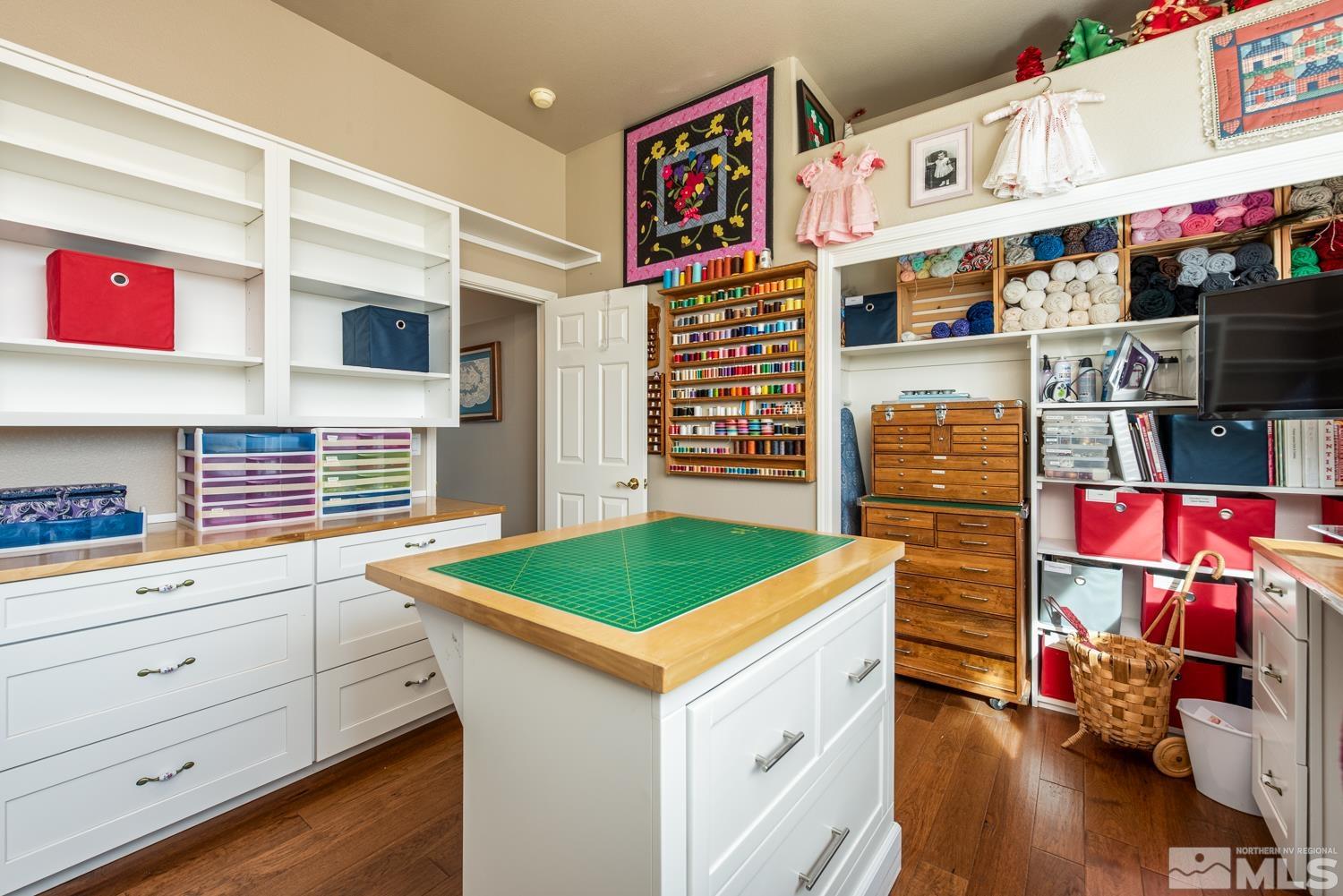 2603 Skyline Drive Minden, NV 89423 - Photo 28 of 40 a utility room with stainless steel appliances kitchen island granite countertop lots of storage and utility