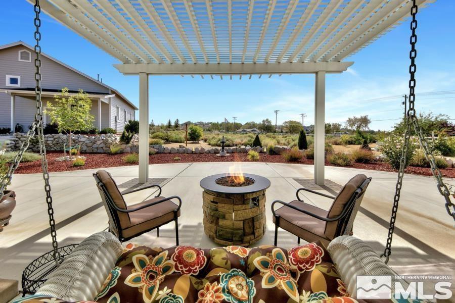 2603 Skyline Drive Minden, NV 89423 - Photo 7 of 40 a view of a patio with a dining table and chairs with a patio