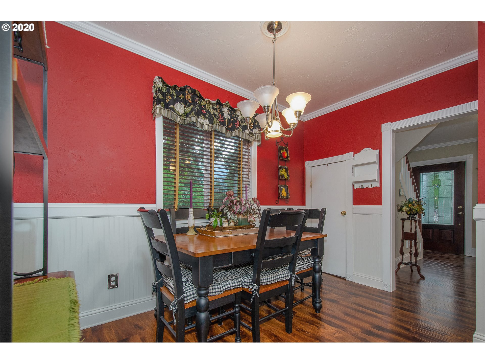 301 Sargent Street Ridgefield, WA 98642 - Photo 12 of 28 a view of a dining room with furniture wooden floor and chandelier