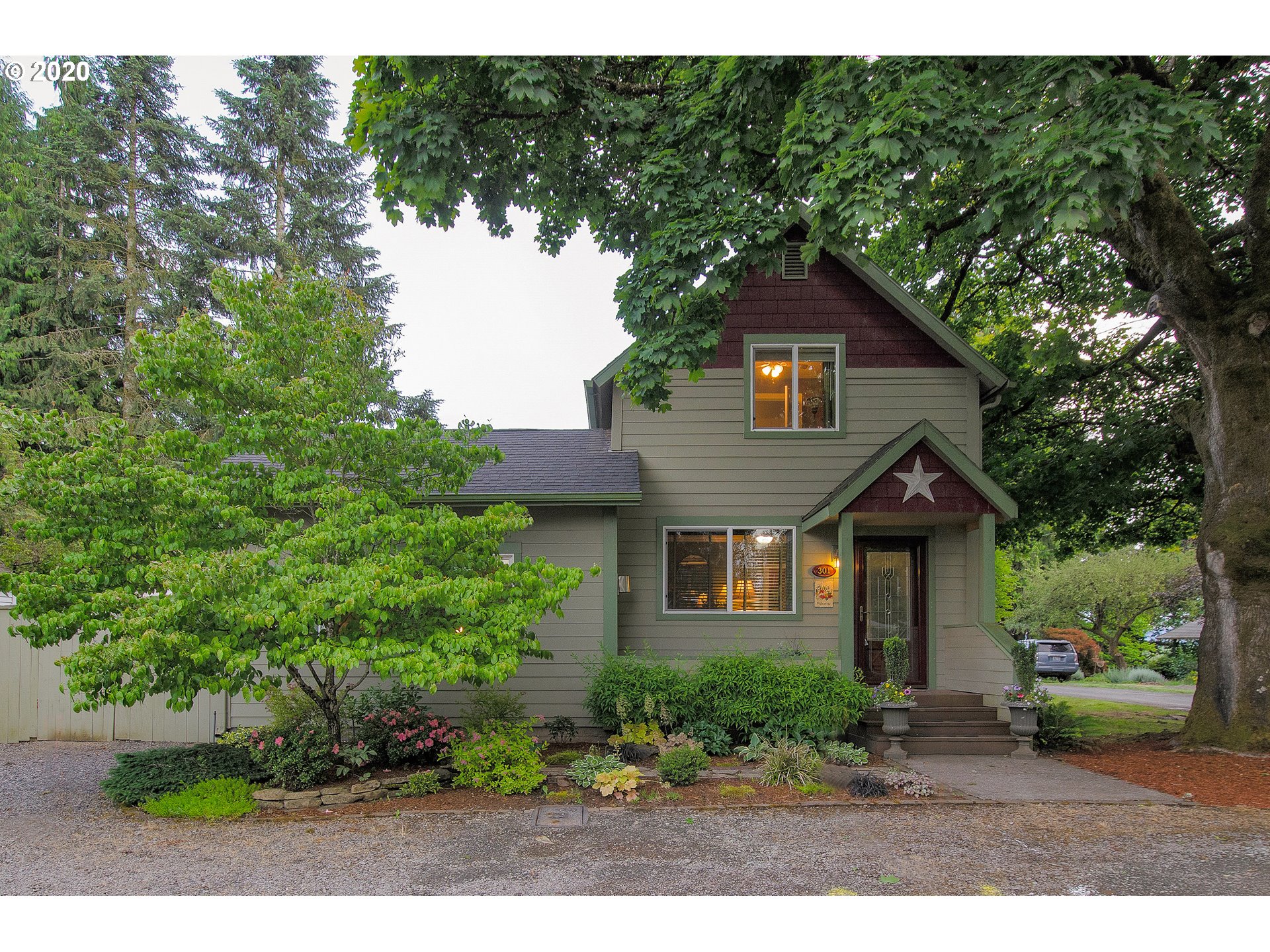 301 Sargent Street Ridgefield, WA 98642 - Photo 28 of 28 a front view of a house with a yard and trees