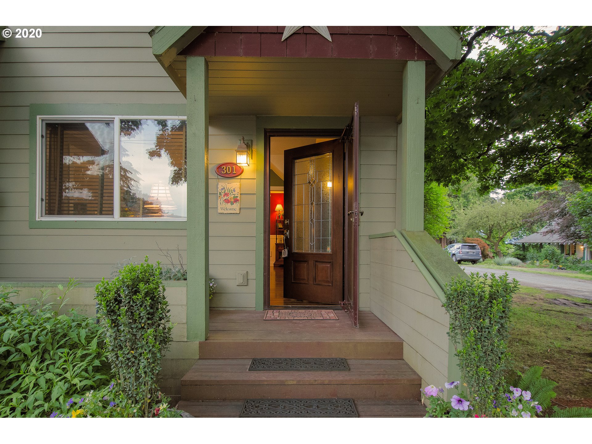 301 Sargent Street Ridgefield, WA 98642 - Photo 3 of 28 a view of a front door of the house and a yard
