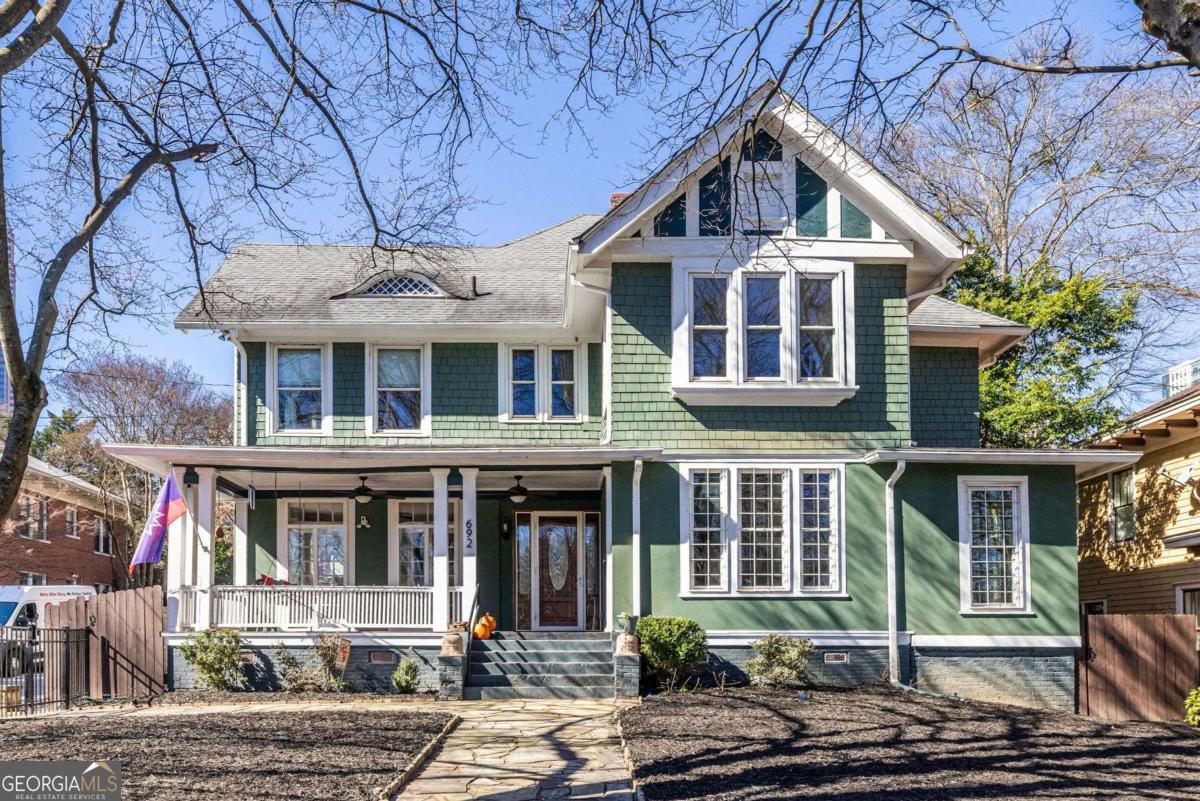 692 Myrtle Street Northeast Atlanta, GA 30308 - Photo 1 of 73 a front view of a house with a yard