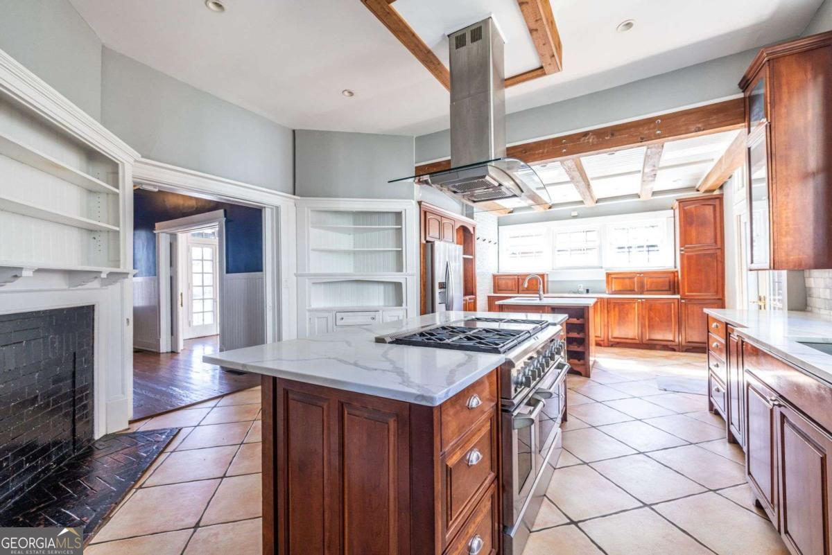 692 Myrtle Street Northeast Atlanta, GA 30308 - Photo 18 of 73 a kitchen with stainless steel appliances granite countertop a stove a sink and a refrigerator