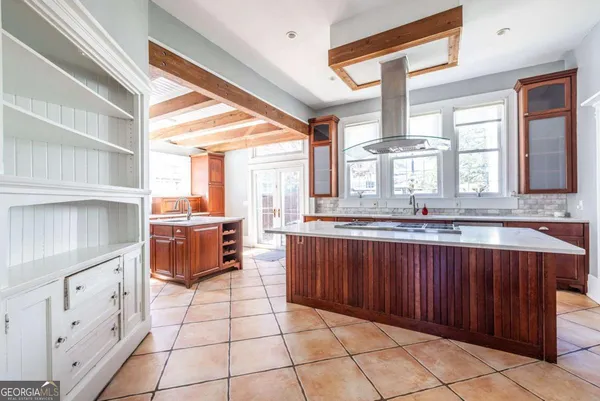 a empty room with wooden floor and window
