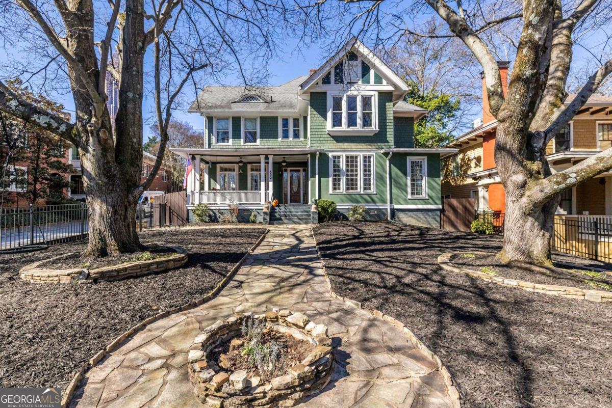 692 Myrtle Street Northeast Atlanta, GA 30308 - Photo 2 of 73 a front view of a house with a yard