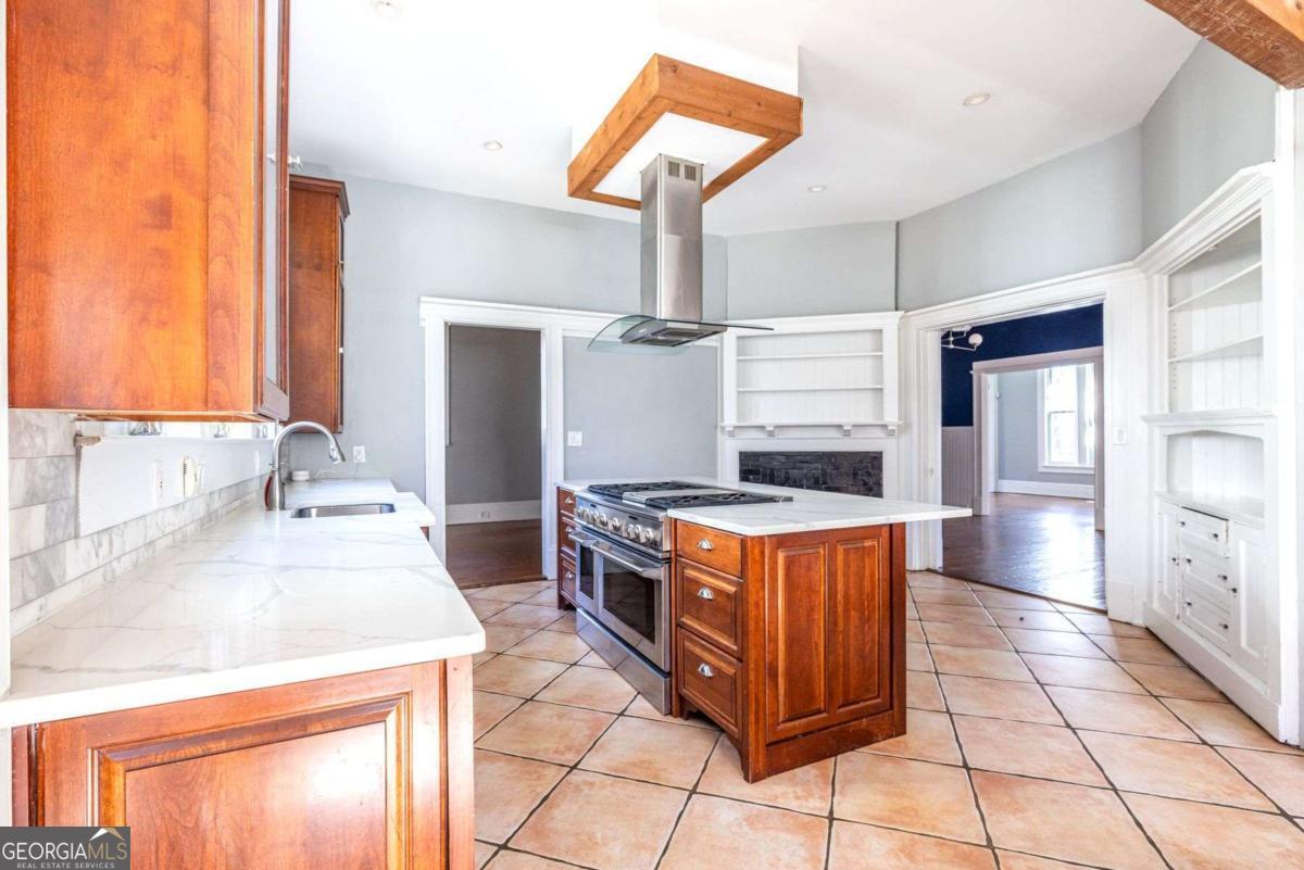 692 Myrtle Street Northeast Atlanta, GA 30308 - Photo 22 of 73 a kitchen with stainless steel appliances a stove a sink and a refrigerator