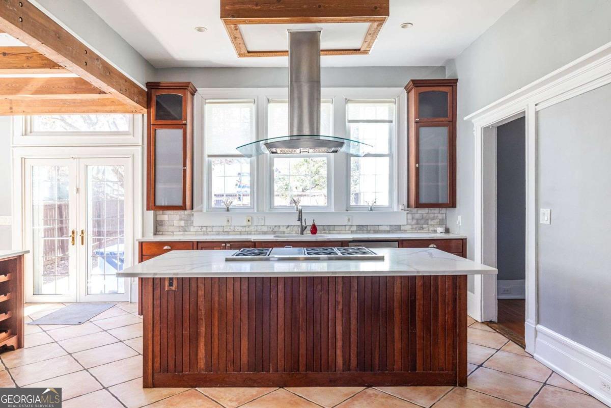 692 Myrtle Street Northeast Atlanta, GA 30308 - Photo 23 of 73 a bathroom with a granite countertop sink and a large mirror next to a window