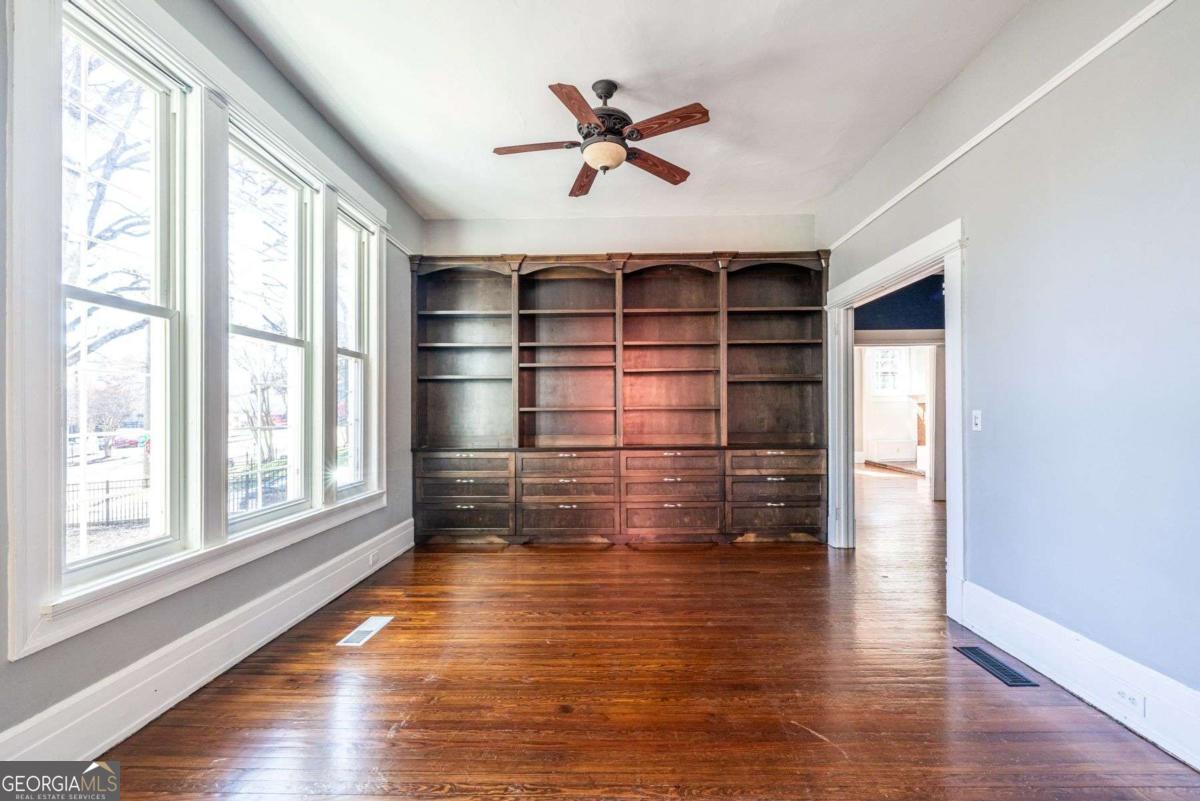 692 Myrtle Street Northeast Atlanta, GA 30308 - Photo 32 of 73 wooden floor in an empty room with a window