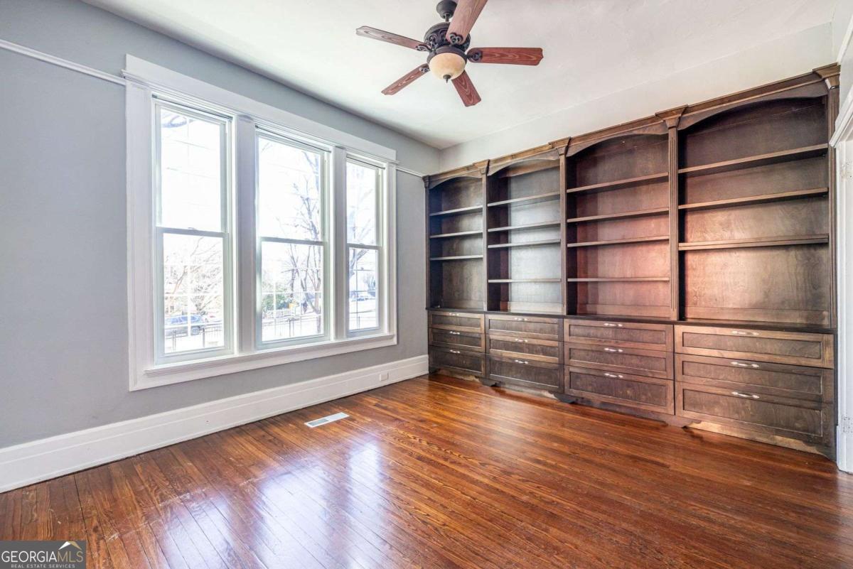 692 Myrtle Street Northeast Atlanta, GA 30308 - Photo 33 of 73 a empty room with wooden floor and window