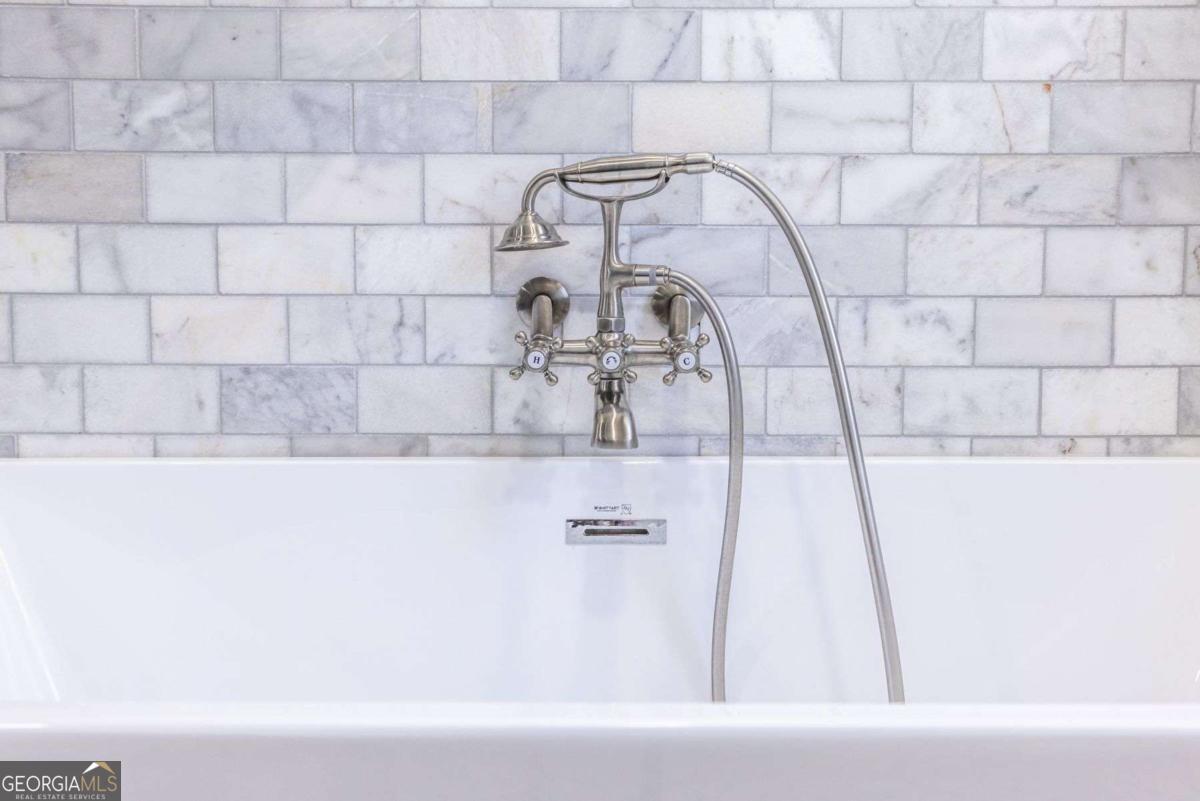 692 Myrtle Street Northeast Atlanta, GA 30308 - Photo 57 of 73 a bathroom with a bathtub