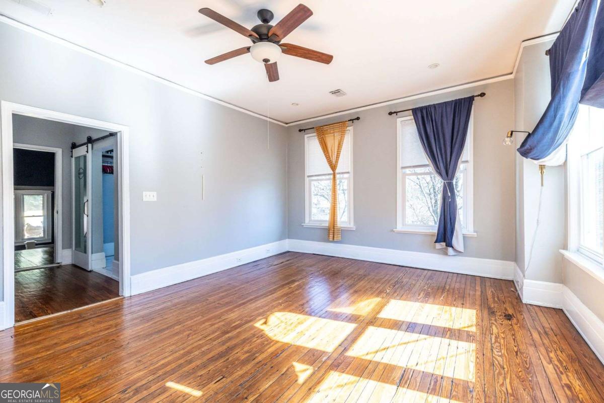 692 Myrtle Street Northeast Atlanta, GA 30308 - Photo 58 of 73 wooden floor in an empty room with a window