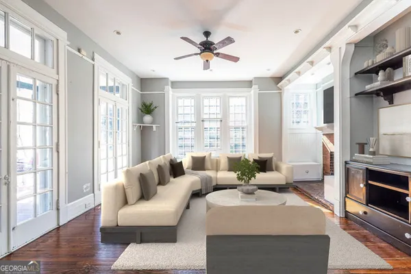 a living room with furniture and a fireplace