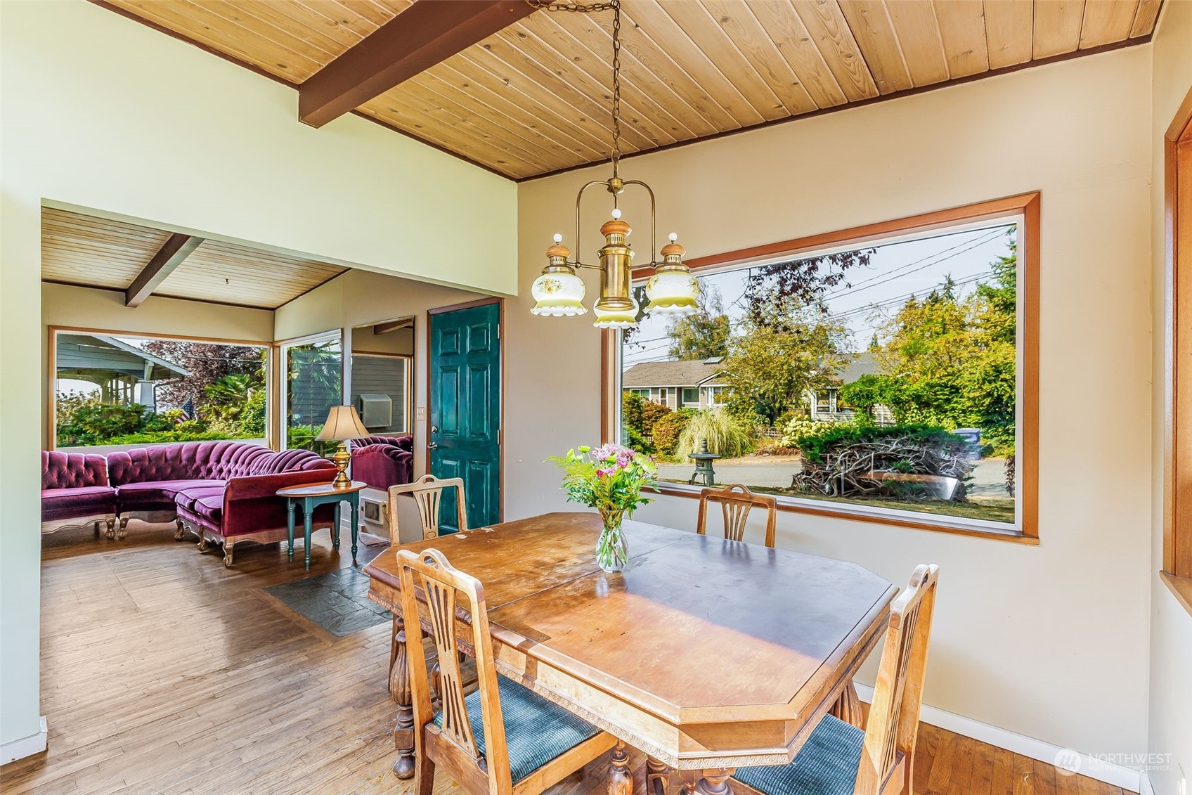 1213 North 33rd Street Renton, WA 98056 - Photo 11 of 28 a view of a dining room with furniture window and wooden floor
