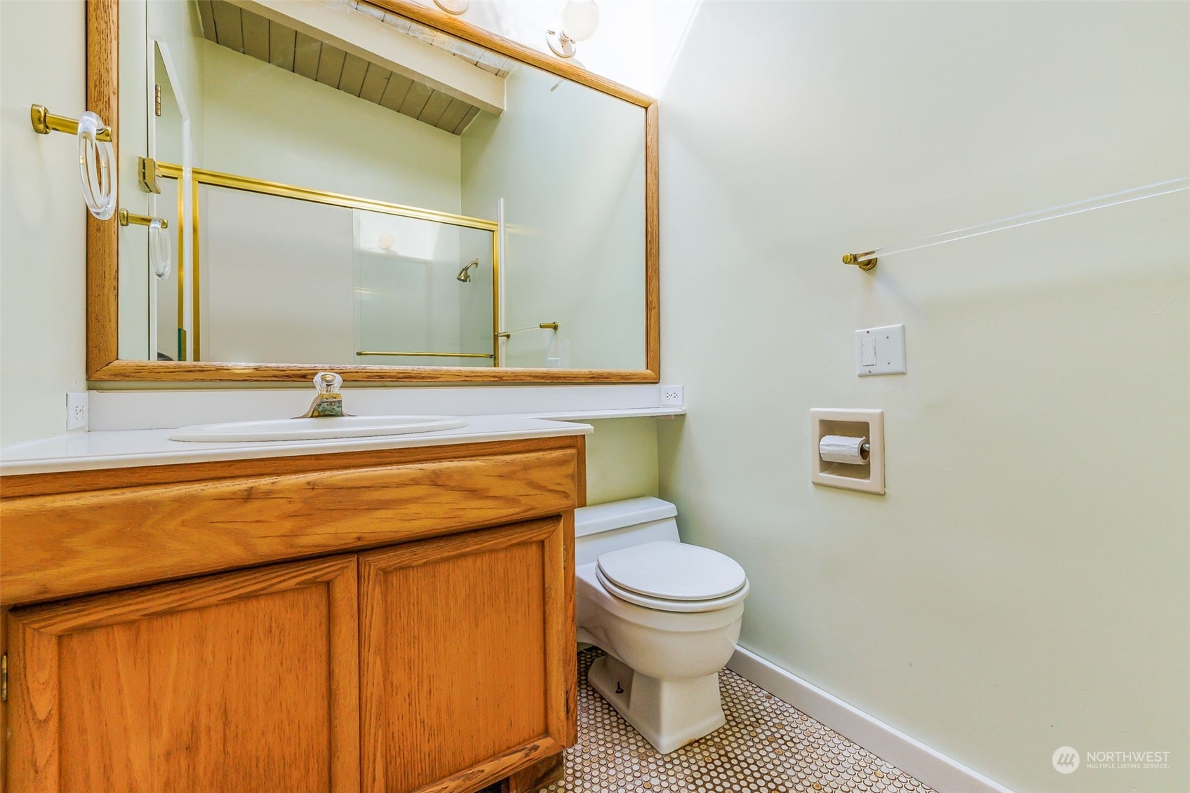 1213 North 33rd Street Renton, WA 98056 - Photo 17 of 28 a bathroom with a toilet sink and mirror