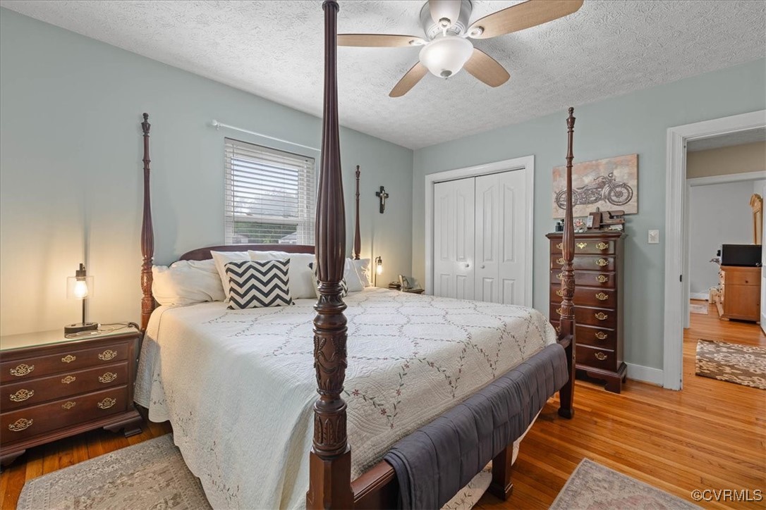 1926 Point Of Rocks Road Chester, VA 23836 - Photo 14 of 29 a bedroom with a bed and a chandelier