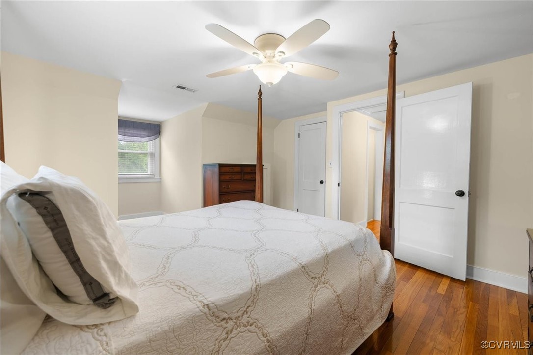 1926 Point Of Rocks Road Chester, VA 23836 - Photo 21 of 29 a spacious bedroom with a bed and a chandelier