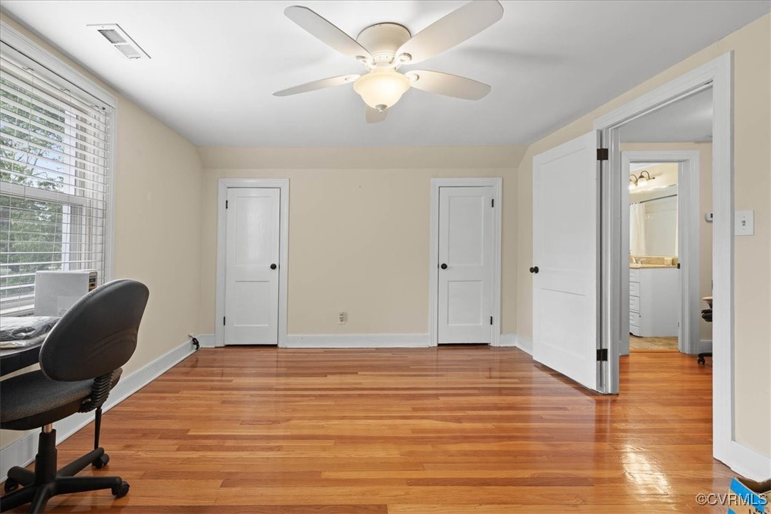 1926 Point Of Rocks Road Chester, VA 23836 - Photo 23 of 29 a view of a livingroom with wooden floor and a ceiling fan
