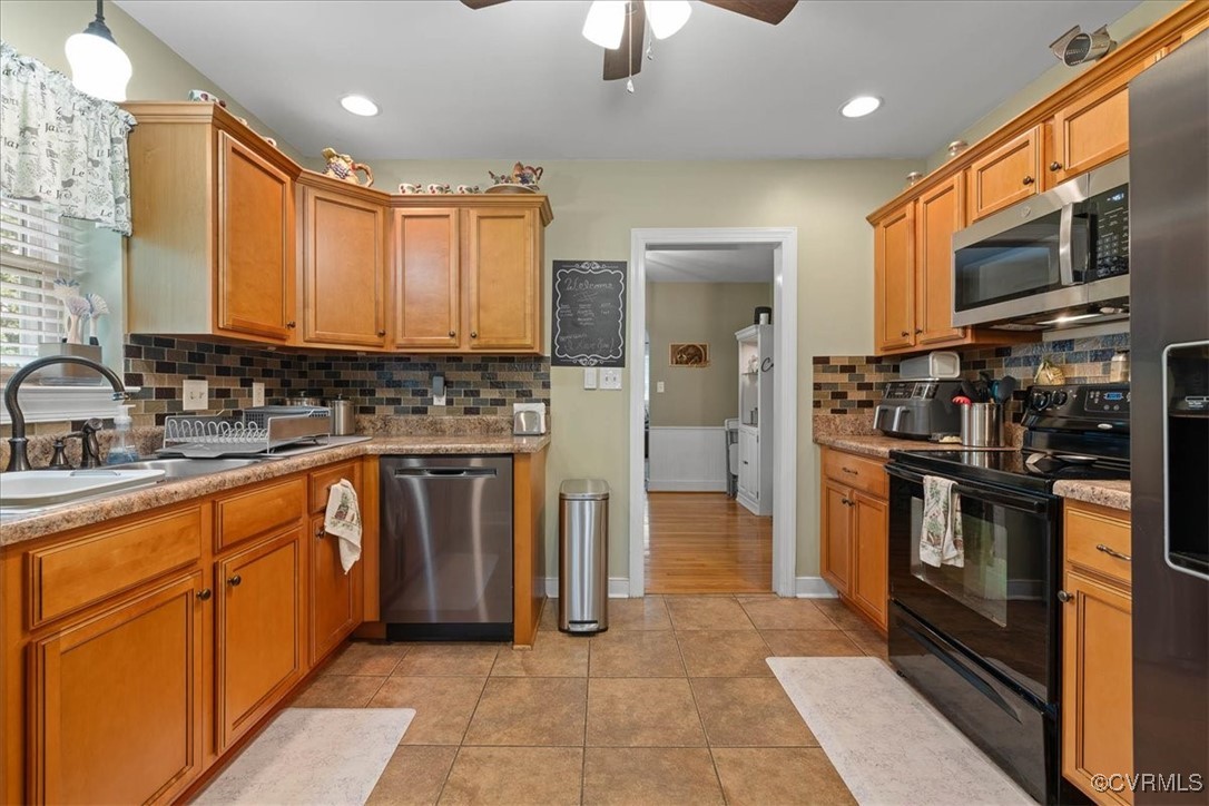 1926 Point Of Rocks Road Chester, VA 23836 - Photo 7 of 29 a kitchen with stainless steel appliances granite countertop a refrigerator and a stove top oven