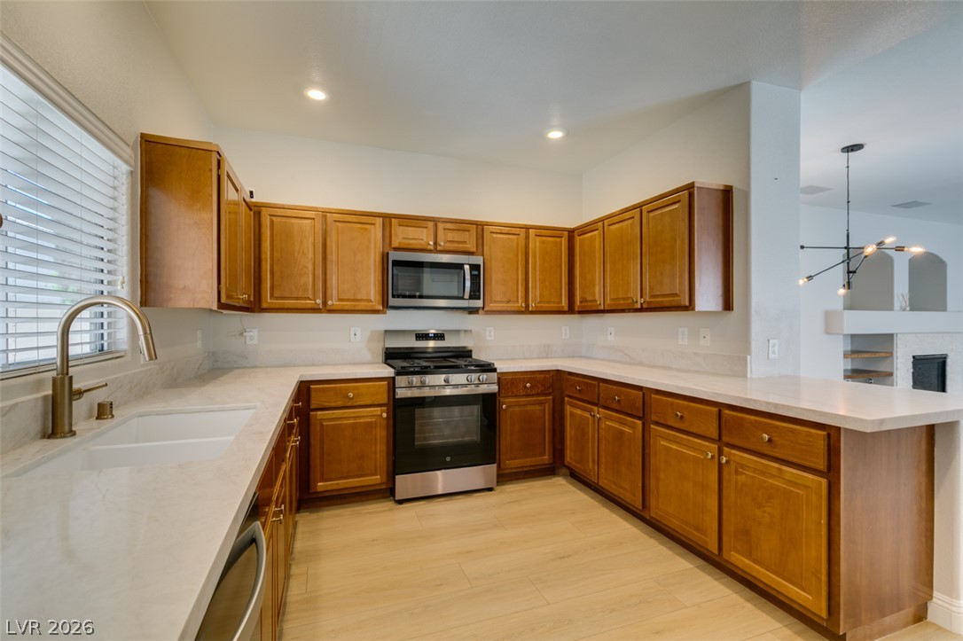 8909 Houston Ridge Avenue Las Vegas, NV 89178 - Photo 17 of 45 Culinary delights await in this chef-inspired kitchen with abundant cabinetry and elegant countertops.