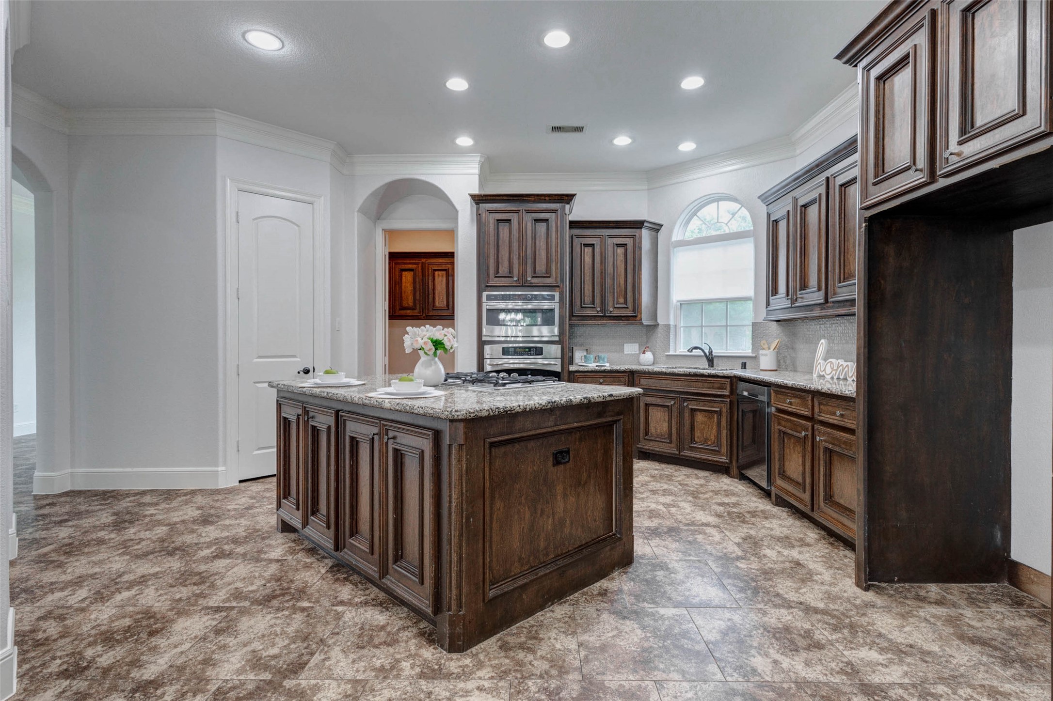 5327 Whitmore Fulshear, TX 77441 - Photo 17 of 50 Thoughtfully designed with exceptional storage and workspace, the kitchen also features a recently replaced microwave/oven (2026), offering added convenience and peace of mind.