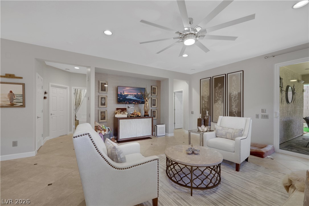 2635 Dirleton Place Henderson, NV 89044 - Photo 9 of 50 Recessed lighting and tile floors define this airy, open-concept living space.