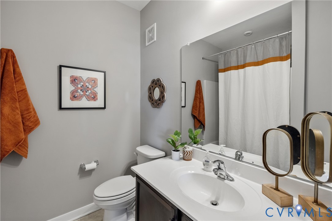 5340 Good Lndg Road, Unit 103 Glen Allen, VA 23059 - Photo 17 of 29 a bathroom with a sink vanity mirror and toilet