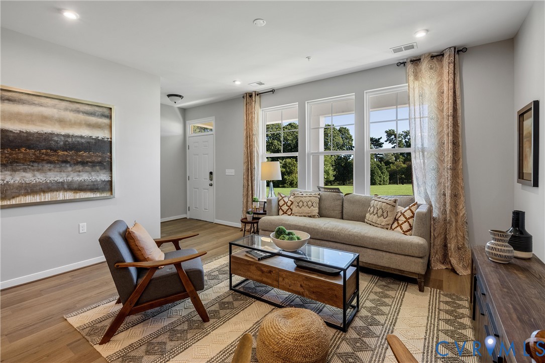 5340 Good Lndg Road, Unit 103 Glen Allen, VA 23059 - Photo 3 of 29 a living room with furniture and a large window