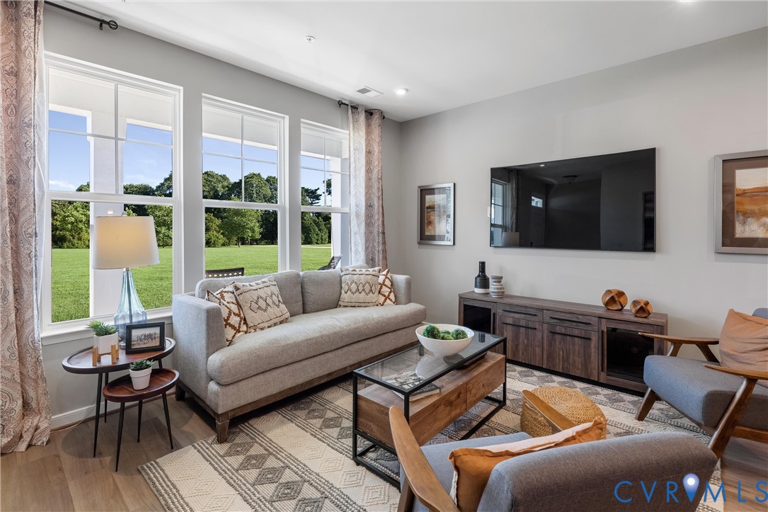 5340 Good Lndg Road, Unit 103 Glen Allen, VA 23059 - Photo 4 of 29 a living room with furniture and a flat screen tv