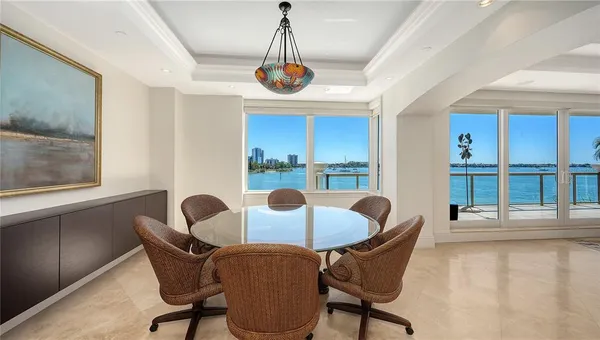 a dining room with furniture and window