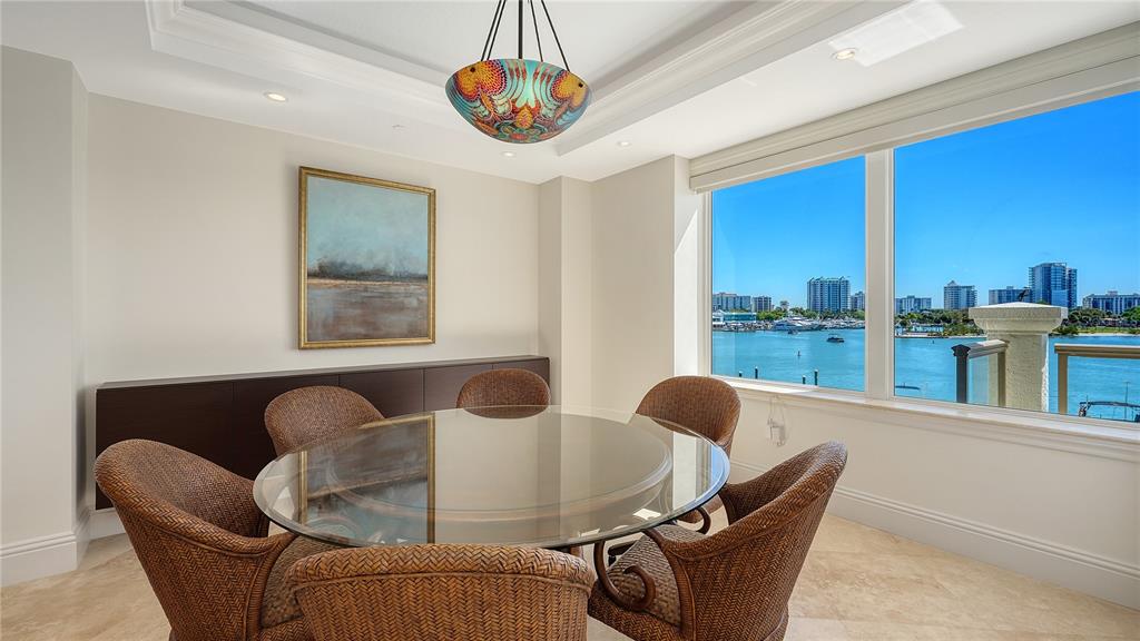 464 Golden Gate Point, Unit 304 Sarasota, FL 34236 - Photo 13 of 60 a dining room with furniture and a large window