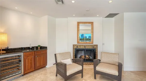 a living room with furniture a window and a fireplace