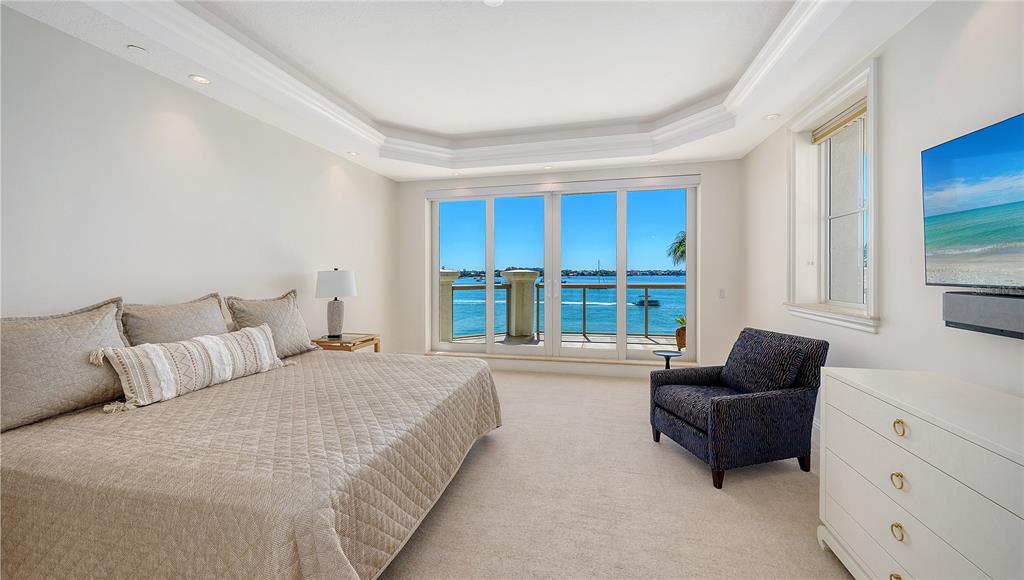 464 Golden Gate Point, Unit 304 Sarasota, FL 34236 - Photo 21 of 60 a bedroom with furniture and large windows