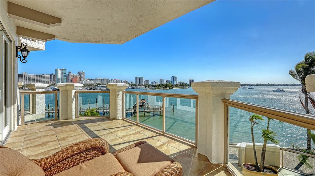 464 Golden Gate Point, Unit 304 Sarasota, FL 34236 - Photo 23 of 60 a view of balcony with two chairs and a table