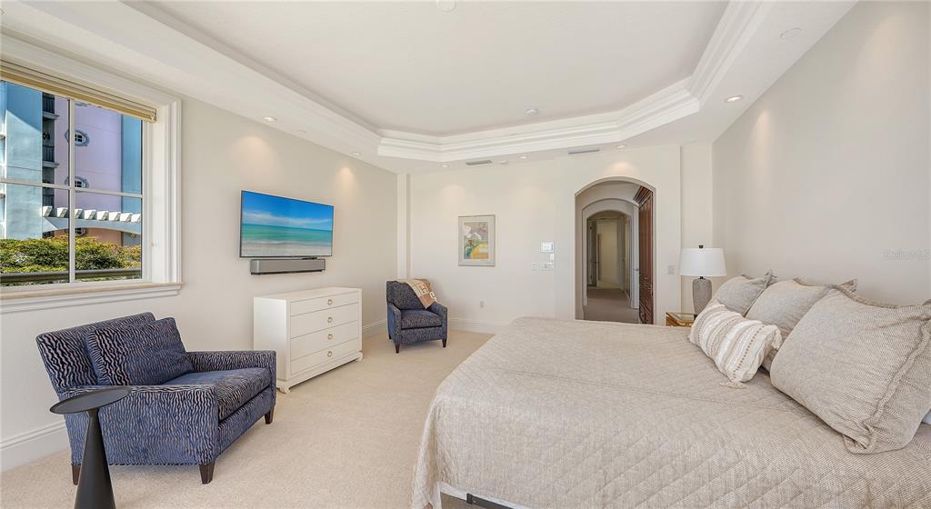 464 Golden Gate Point, Unit 304 Sarasota, FL 34236 - Photo 25 of 60 a bedroom with a bed and a couch