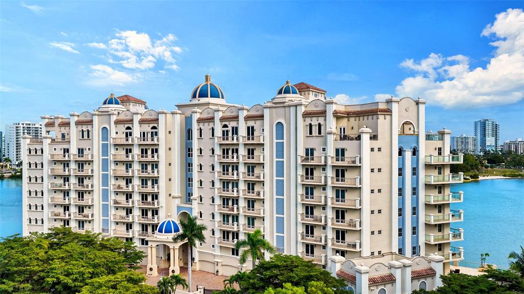 464 Golden Gate Point, Unit 304 Sarasota, FL 34236 - Photo 38 of 60 a view of a building with a yard